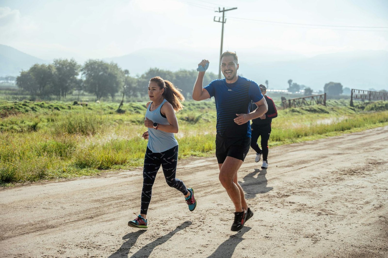 https://www.pexels.com/photo/woman-and-man-running-in-race-on-dirt-road-17979438/